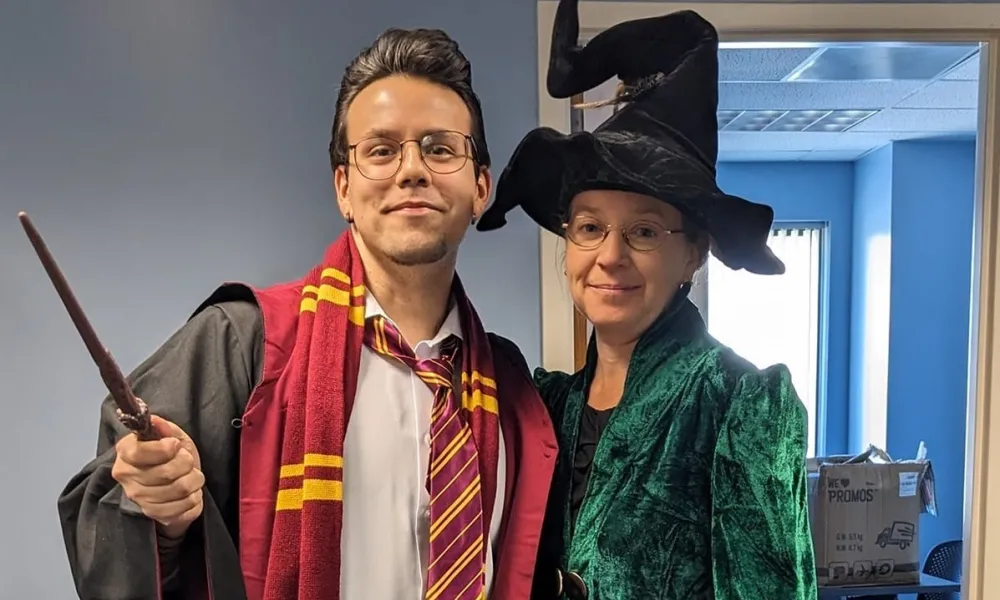 Two people dressed as Harry Potter and Professor McGonagall.
